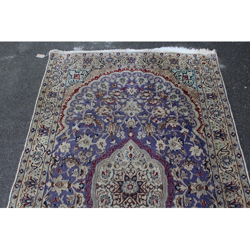 14 - Indo Persian rug with a medallion and all-over palmette design on a mauve ground with borders, 216 x... 