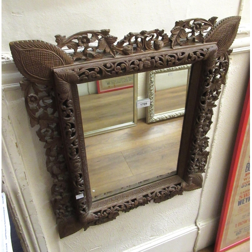 1709 - Eastern rectangular carved wooden hanging wall mirror, 69 x 56cm, together with a small oak framed d... 