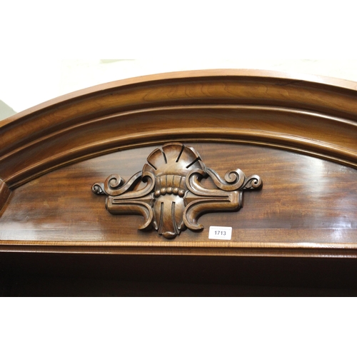 1713 - Large mahogany open bookcase, the moulded broken arch cornice above a decorative frieze and adjustab... 