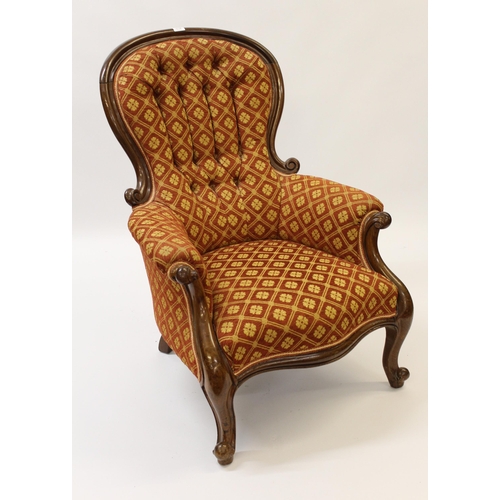 1718 - Victorian carved mahogany and button upholstered drawing room armchair on cabriole front supports