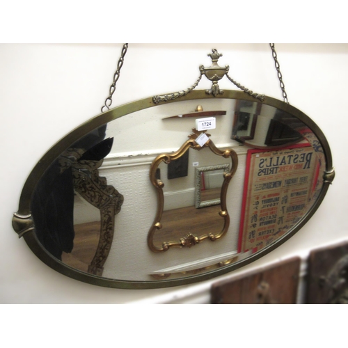 1724 - Oval anodised brass framed wall mirror with urn surmount