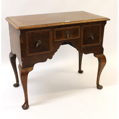 1737 - 18th Century walnut and herringbone inlaid lowboy, the moulded top above three freize drawers, raise... 