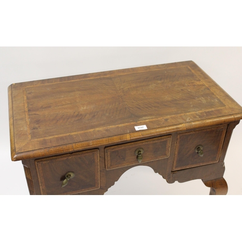 1737 - 18th Century walnut and herringbone inlaid lowboy, the moulded top above three freize drawers, raise... 