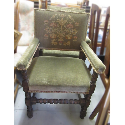 1756 - Pair of oak Cromwellian style open arm chairs with green embroidered backs