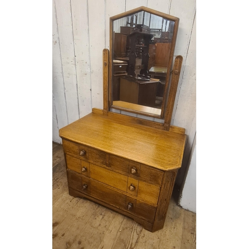 1759 - Arts and Crafts oak bedroom suite comprising:  wardrobe, dressing table and cupboard