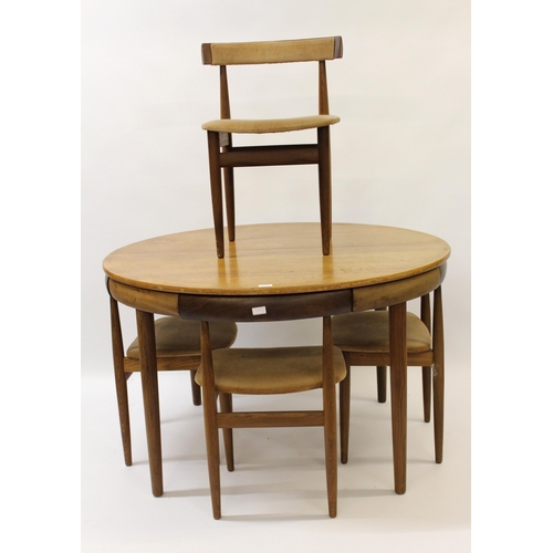 1773 - Small mid 20th Century Danish circular teak dining table with integral leaf, with four chairs each w... 