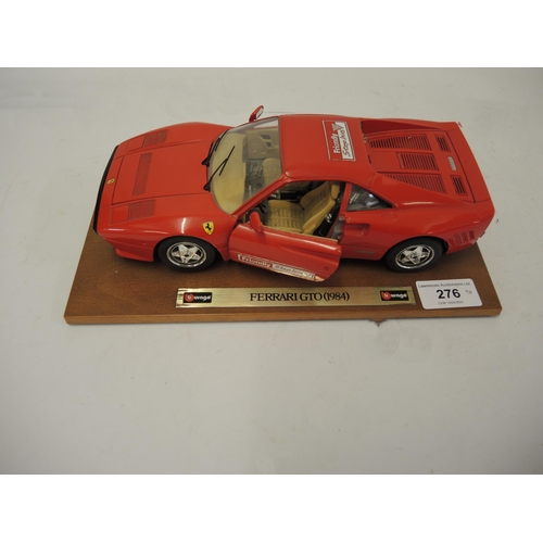 276 - Burago diecast model of a Ferrari GTO 1984, on wooden stand (lacking box)