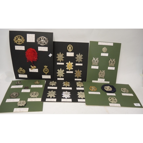 313 - Collection of military cap badges mounted on six cards