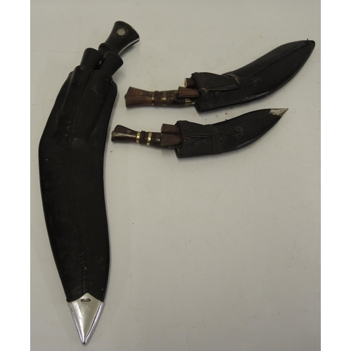 323 - Wilkinson Sword Company kukri and scabbard, the blade inscribed W. S. C. 51, together with two other... 