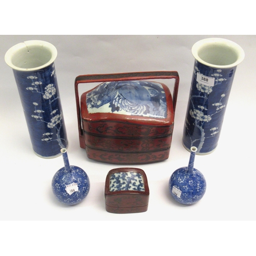 Pair of Chinese blue and white prunus blossom decorated cylindrical flared rim vases, 25cm high together with a pair of Japanese small bottle vases and two Chinese porcelain mounted lacquered boxes