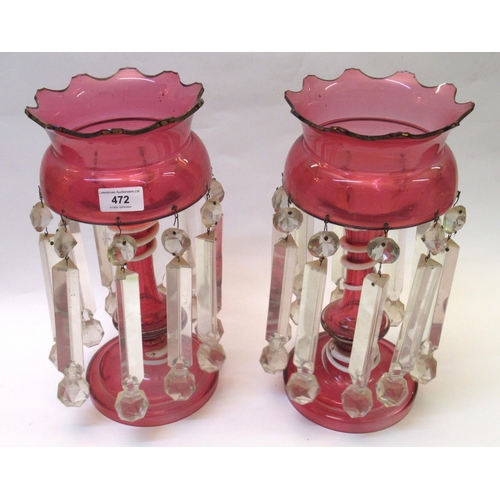 472 - Pair of 19th Century cranberry and opaque glass lustres, the centre columns with decoration in the f... 