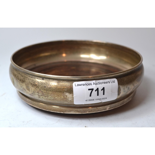 711 - Birmingham silver mounted turned wooden bottle coaster