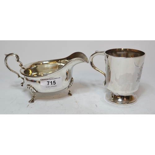 715 - Silver helmet shaped cream jug with C-scroll handle and hoof supports, together with a Sheffield sil... 