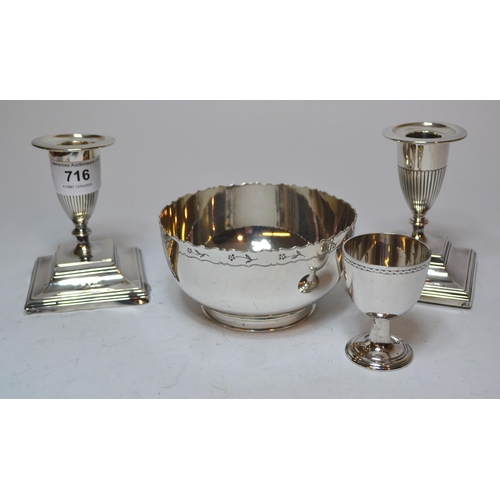 716 - Pair of London silver candlesticks on square bases (one at fault), silver egg cup and a Sheffield si... 