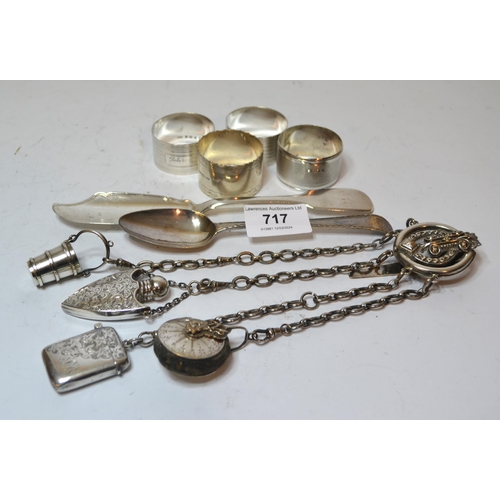 717 - Group of four various silver napkin rings, antique silver spoon, silver butter knife and a chatelain... 