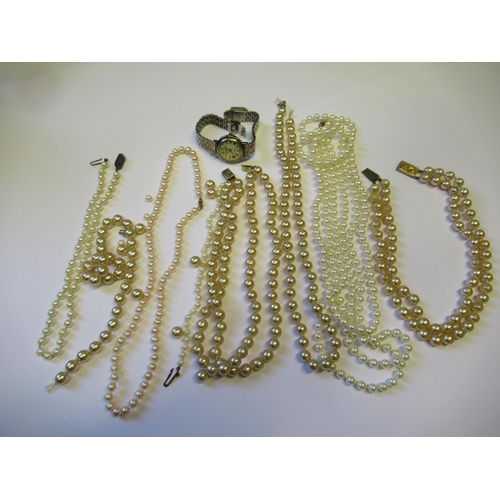 726 - Two single row cultured pearl necklaces, together with various simulated pearl necklaces and a ladie... 