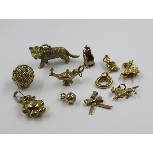 738 - Heavy 9ct gold tiger charm, together with ten other gold charms, gross weight 38.5g