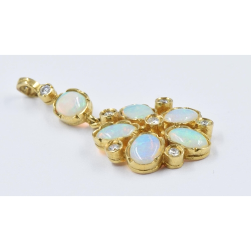 748 - 9ct Gold diamond and opal set pendant