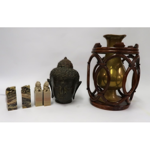 98 - Bronzed metal head of Buddha, brass baluster form vase, four Chinese soapstone seals and a hardwood ... 