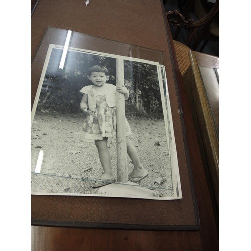 175 - Quantity of 1950's large format photographs, views of Singapore and child portraits