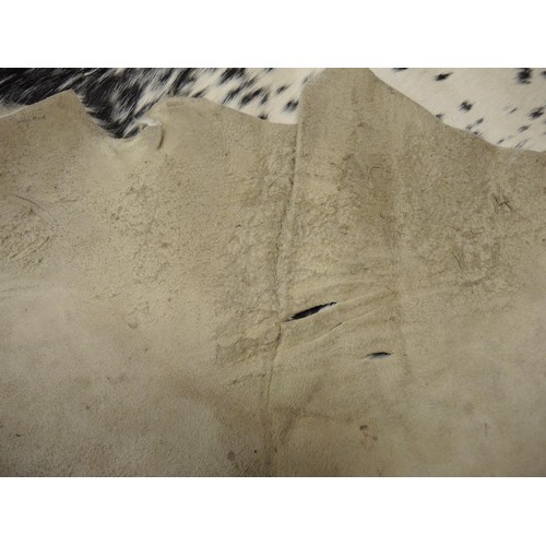 188 - Mottled black, brown and white full cowhide rug