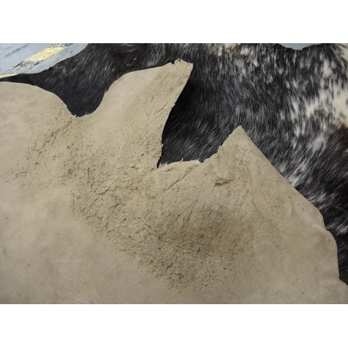 188 - Mottled black, brown and white full cowhide rug