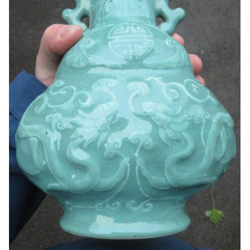 499 - Chinese Celadon two handled vase, relief moulded with dragons (drilled to base), 28cm high