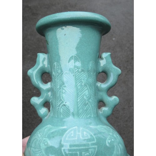 499 - Chinese Celadon two handled vase, relief moulded with dragons (drilled to base), 28cm high