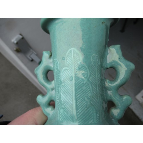 499 - Chinese Celadon two handled vase, relief moulded with dragons (drilled to base), 28cm high