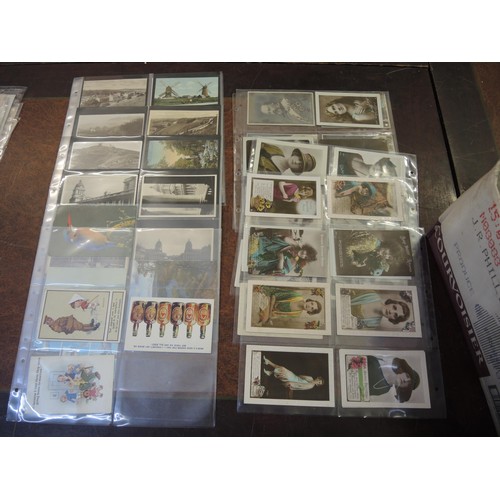 180 - Large collection of early to mid 20th Century postcards mounted in loose leaves, including World War... 