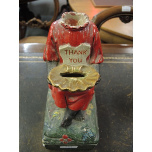 261 - Late 19th / early 20th Century plaster charity money box in the form of a seated child with a shell ... 