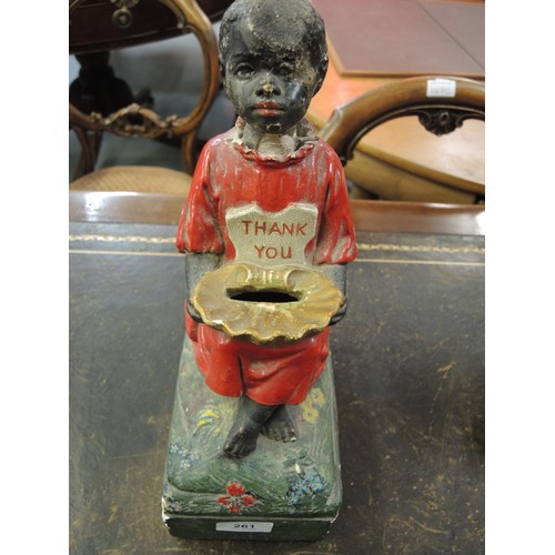 261 - Late 19th / early 20th Century plaster charity money box in the form of a seated child with a shell ... 