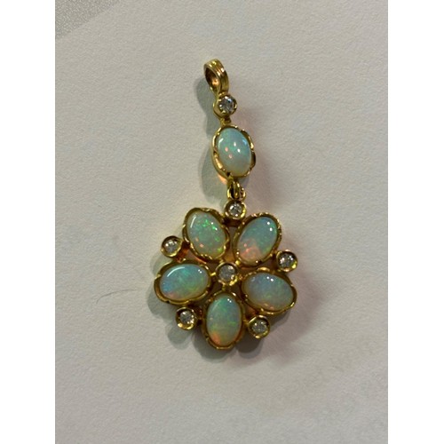 748 - 9ct Gold diamond and opal set pendant