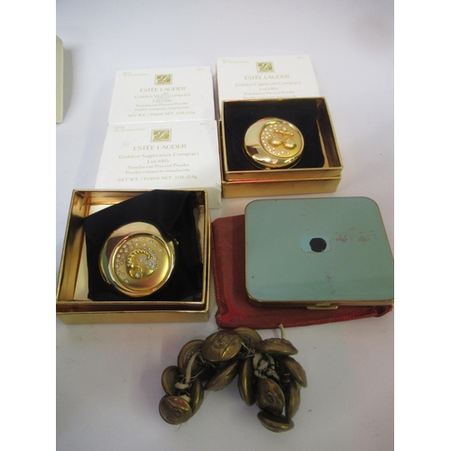 Six various compacts, together with a set of Royal Artillery tunic buttons