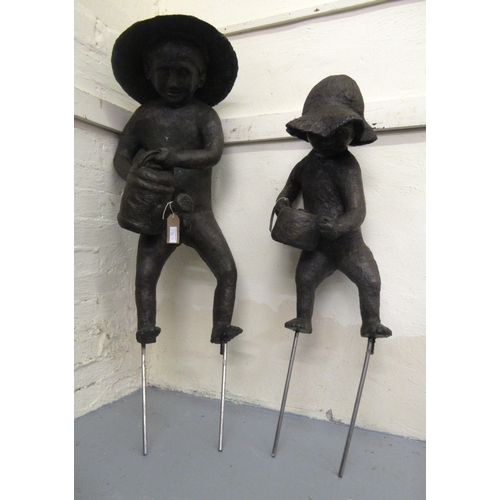 1367 - Gail Runyon Perry, pair of bronzed resin garden sculptures of children gardeners, the tallest 88cm h... 