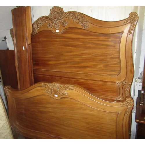 1533 - 19th Century French walnut king size bed having carved decoration and plain side rails, with base (a... 