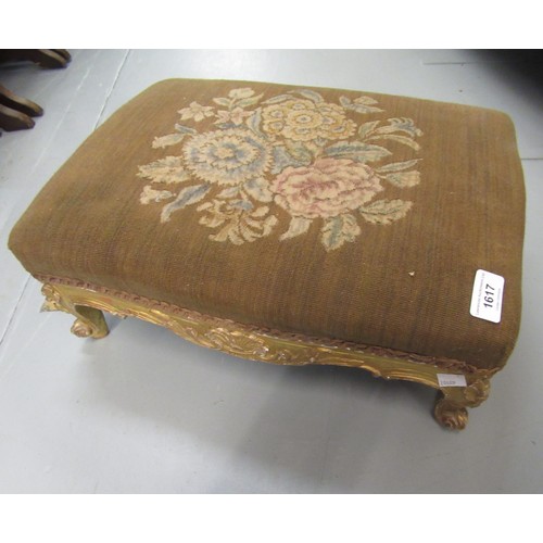 Small Victorian giltwood footstool with floral decorated top on cabriole supports, 44cm wide