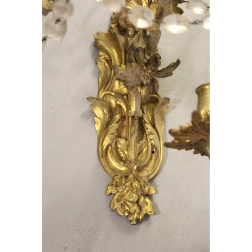 1655 - Pair of 19th Century French ormolu and crystal four branch wall lights, 29cm high