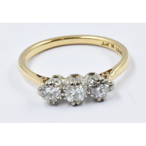 560 - 18ct Yellow gold ring set three diamonds, size K.5, 2.5g