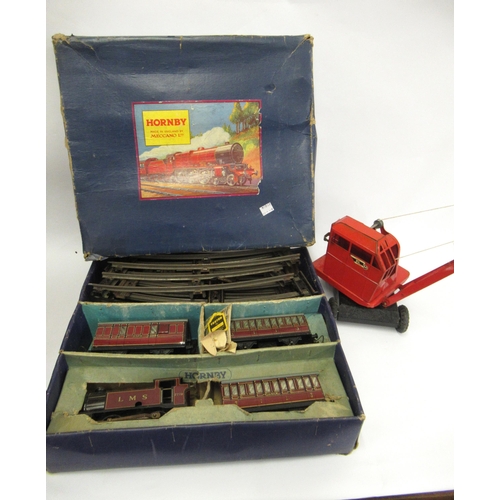 100 - Triang children's pull-along toy crane and a boxed Hornby Meccano 'O' gauge clockwork tin plate trai... 