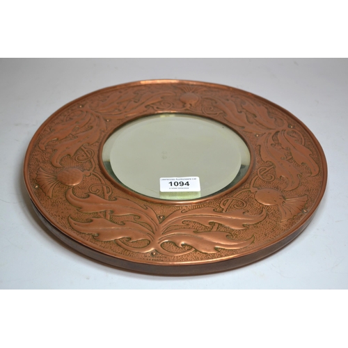 1094 - Keswick School of Industrial Arts, circular repousse copper wall mirror, signed W.H. Wilson, 30.5cm ... 