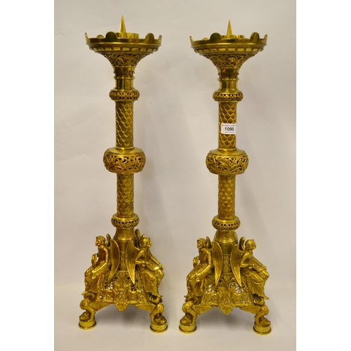 1098 - Pair of fine quality gilt brass altar candlesticks of Gothic design, the triangular bases each mount... 