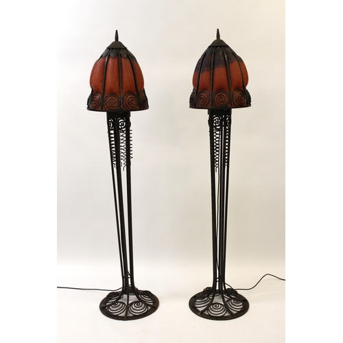 1099 - Pair of late 20th Century dark patinated wrought iron and mottled glass floor lamps of Arts and Craf... 