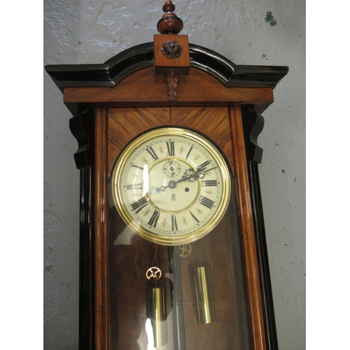 1106 - Late 19th Century Continental walnut and part ebonised Vienna style wall clock, the architectural ca... 