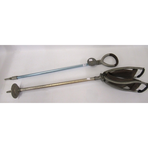 111 - Two 20th century leather mounted cast aluminium and steel shooting sticks