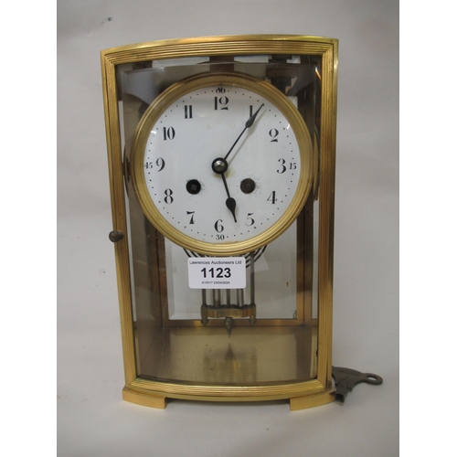 1123 - 19th Century French two train clock, the circular enamel dial with Arabic numerals, striking on a be... 