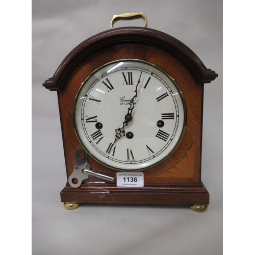 1136 - Comitti of London mahogany cased three train mantel clock, striking on gongs, 28cm high