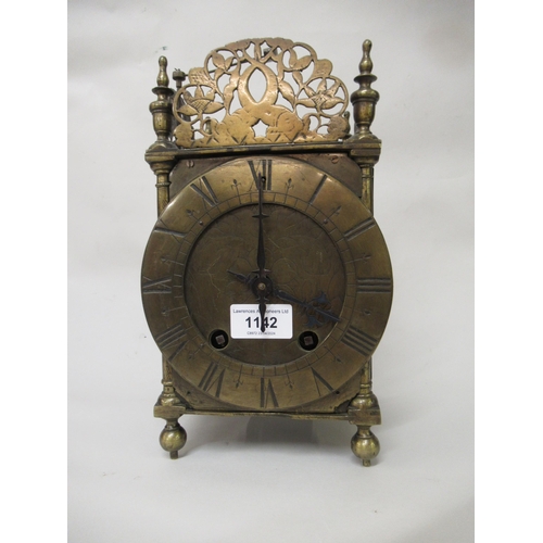 1142 - Brass lantern clock, the pierced surmount above an engraved circular dial with Roman numerals, the c... 