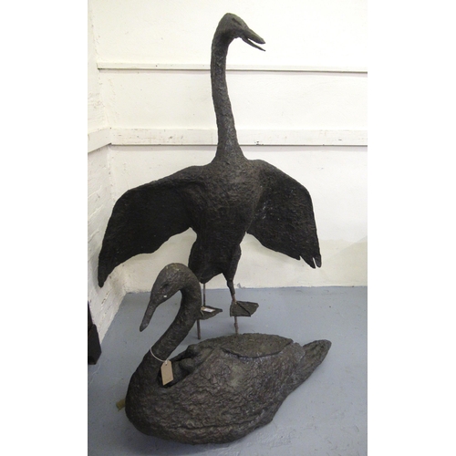 1145 - Gail Runyon Perry, pair of bronzed composition garden sculptures of male and female swans with young... 