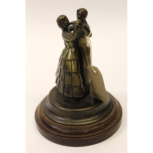 1151 - Patinated brass dancing trophy, the Frank Ford award, depicting two ballroom dancers on a circular w... 